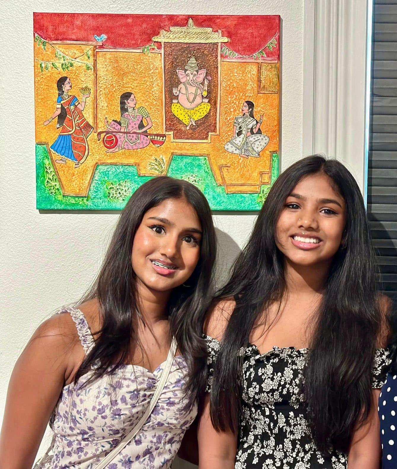 Two Students With Artwork